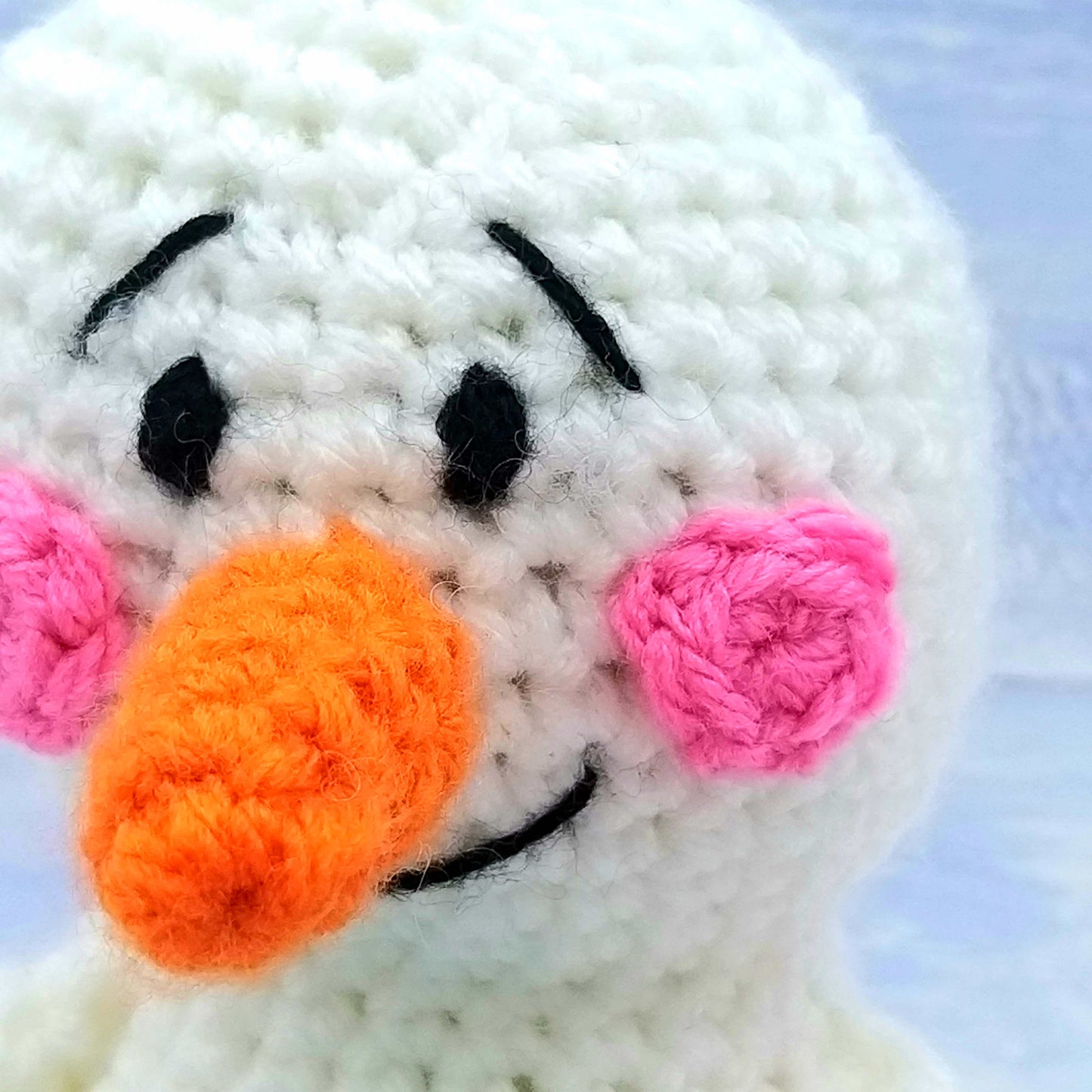 Close up of Chilli's carrot nose and rosy cheeks