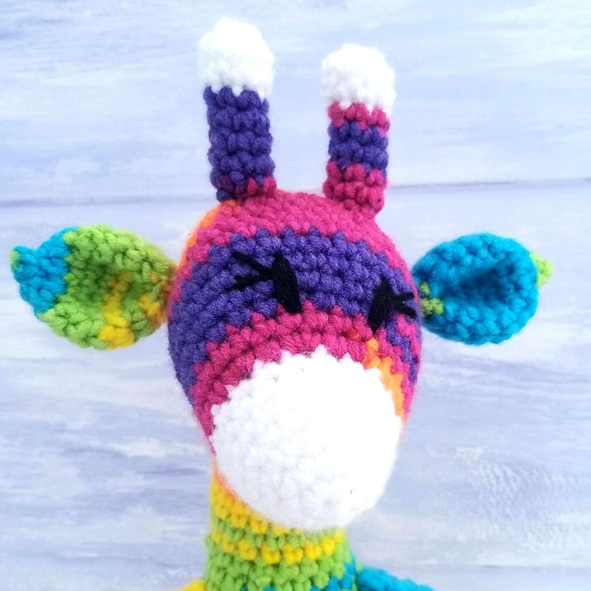 Close up - stitching details toy giraffe's head