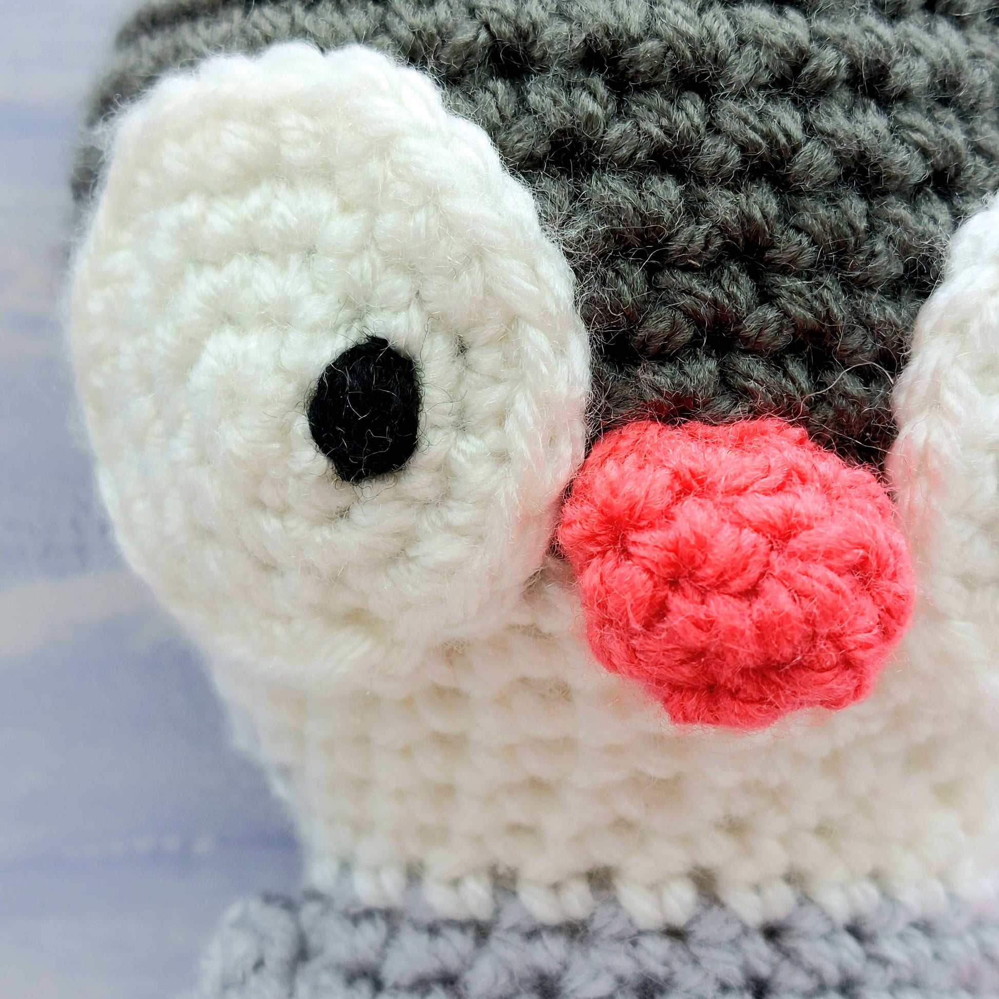 close up of crochet detail on Penguijns nose and eyes