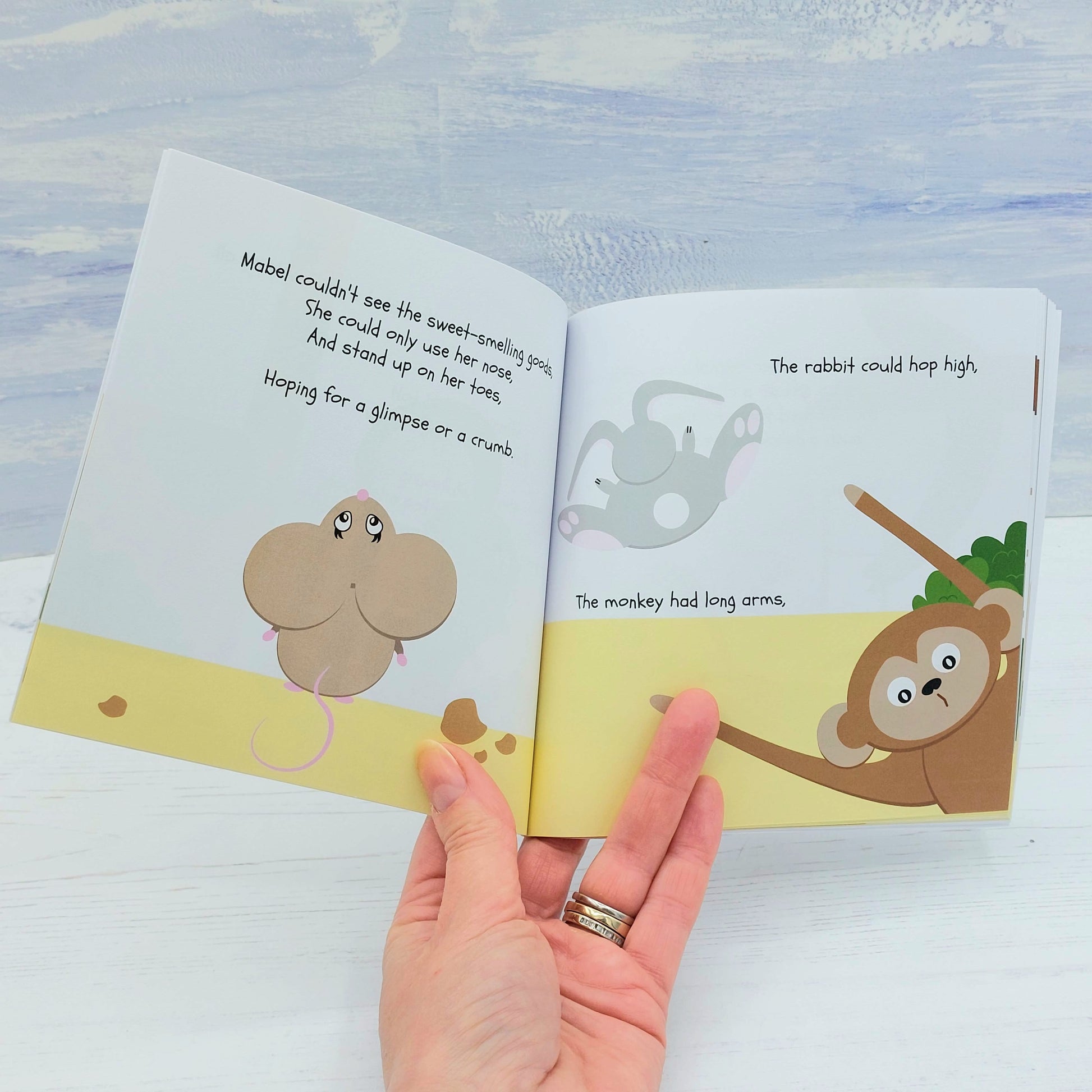 Inside the book - "the rabbit could hop high. The monkey had long arms"