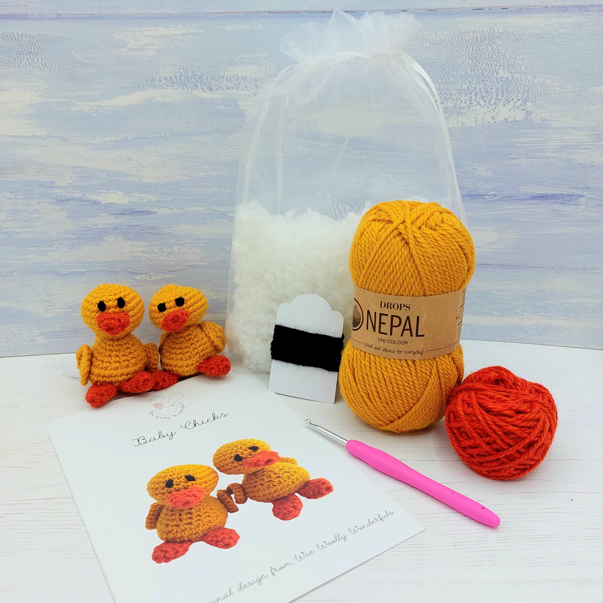 Yellow and orange yarn, stuffing, pattern and crochet hook