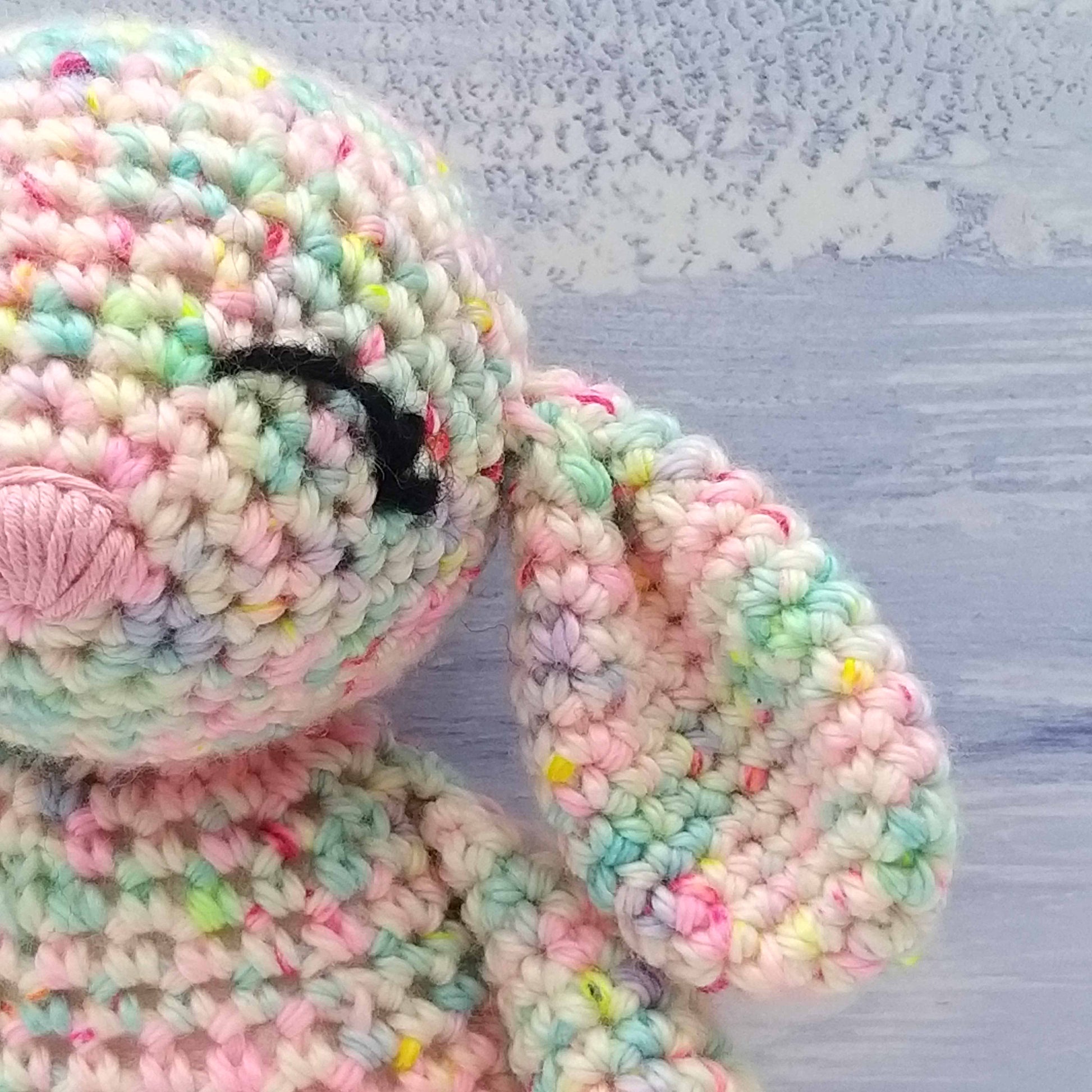 close up of crochet rabbit ear and face
