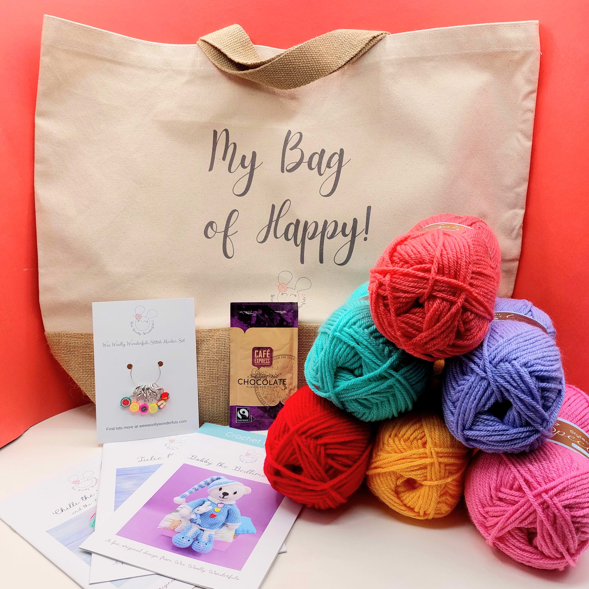 Contents of Crochet Gift Bag including wool and crochet patterns