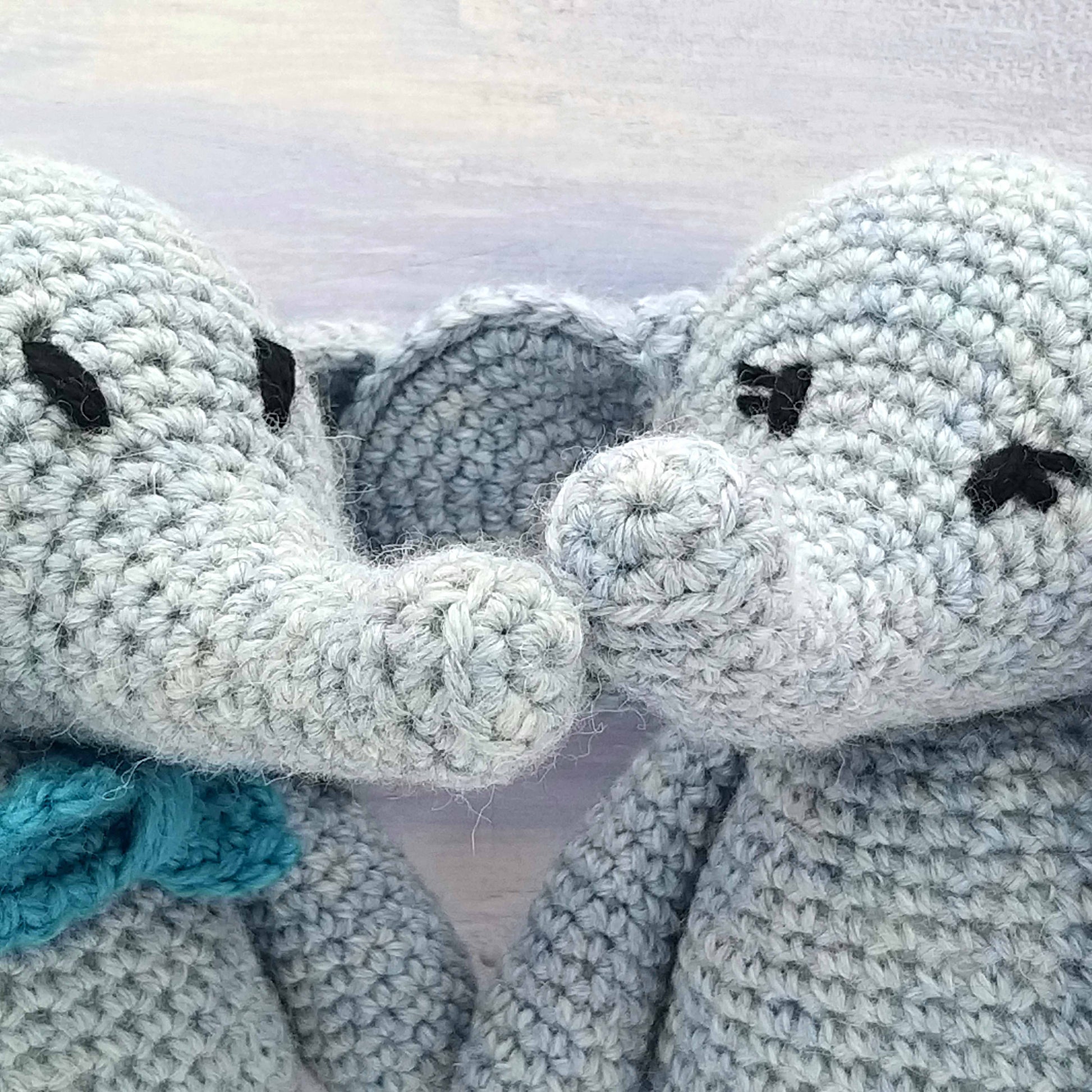 Close up of crochet stitching on toy elephants trunk