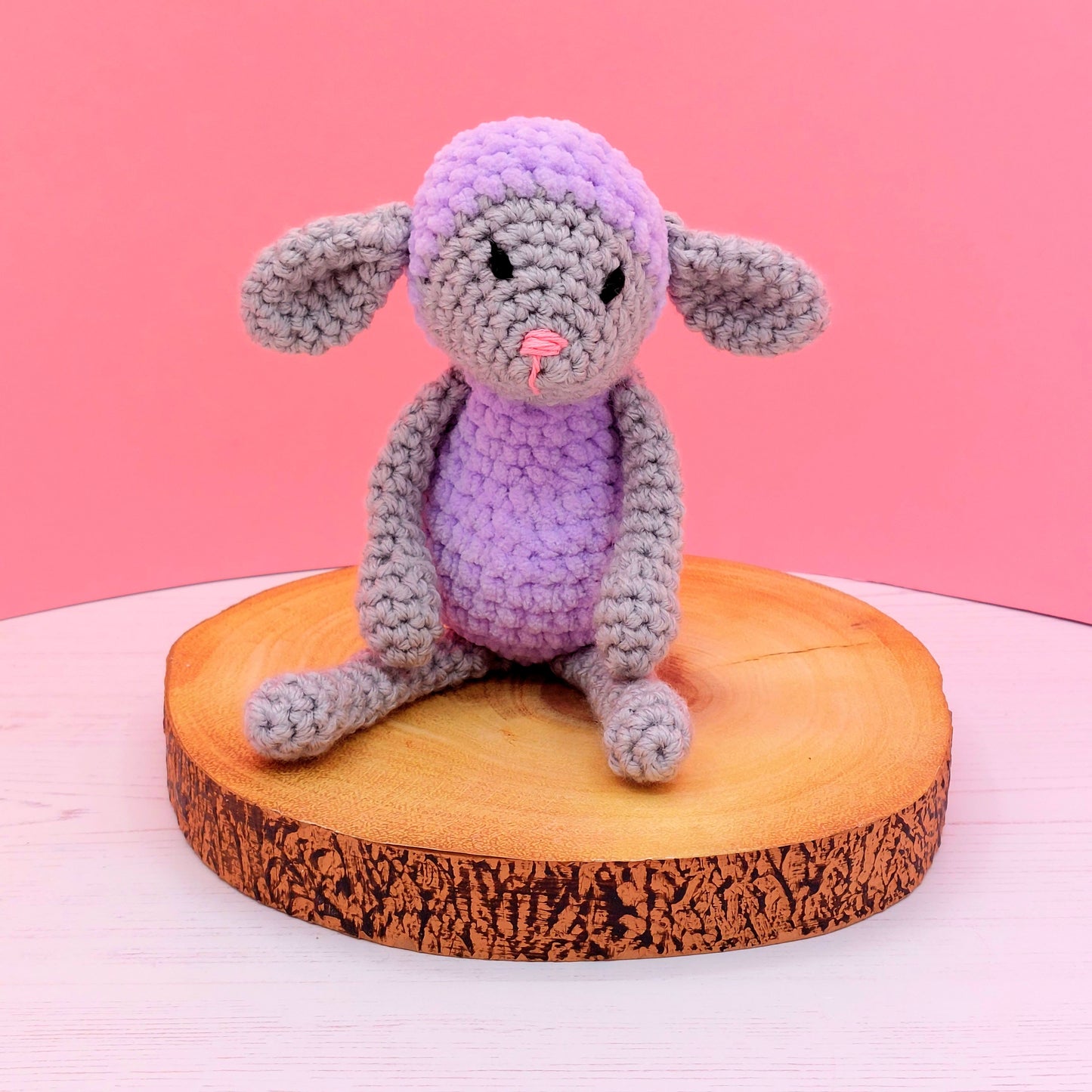 Grey lamb with purple clothes