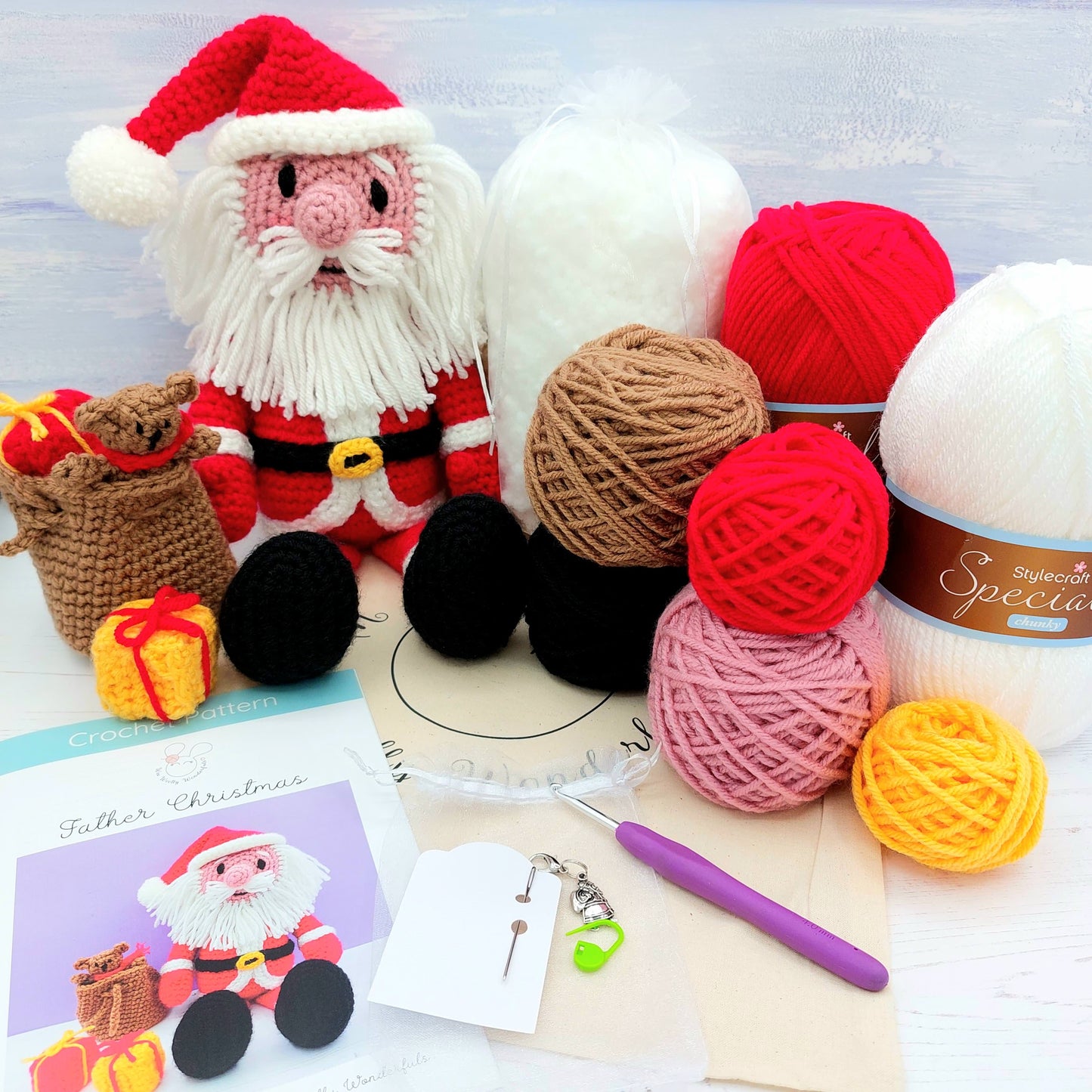 Full contents of Christmas crochet kit - wall, patterns, and crochet hook