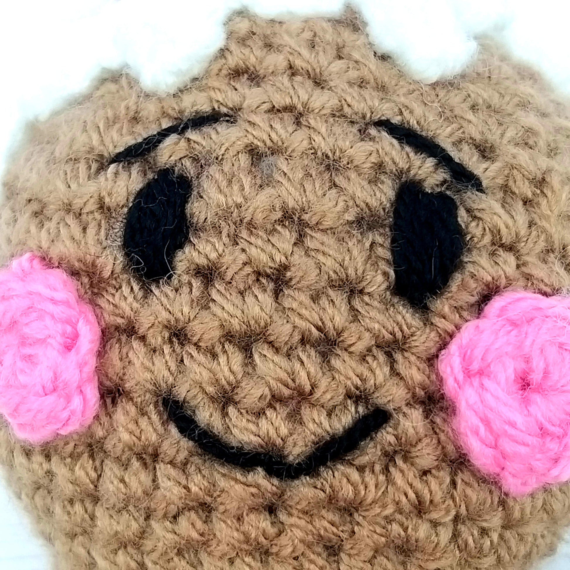 Close up of crochet Gingerbread mans face