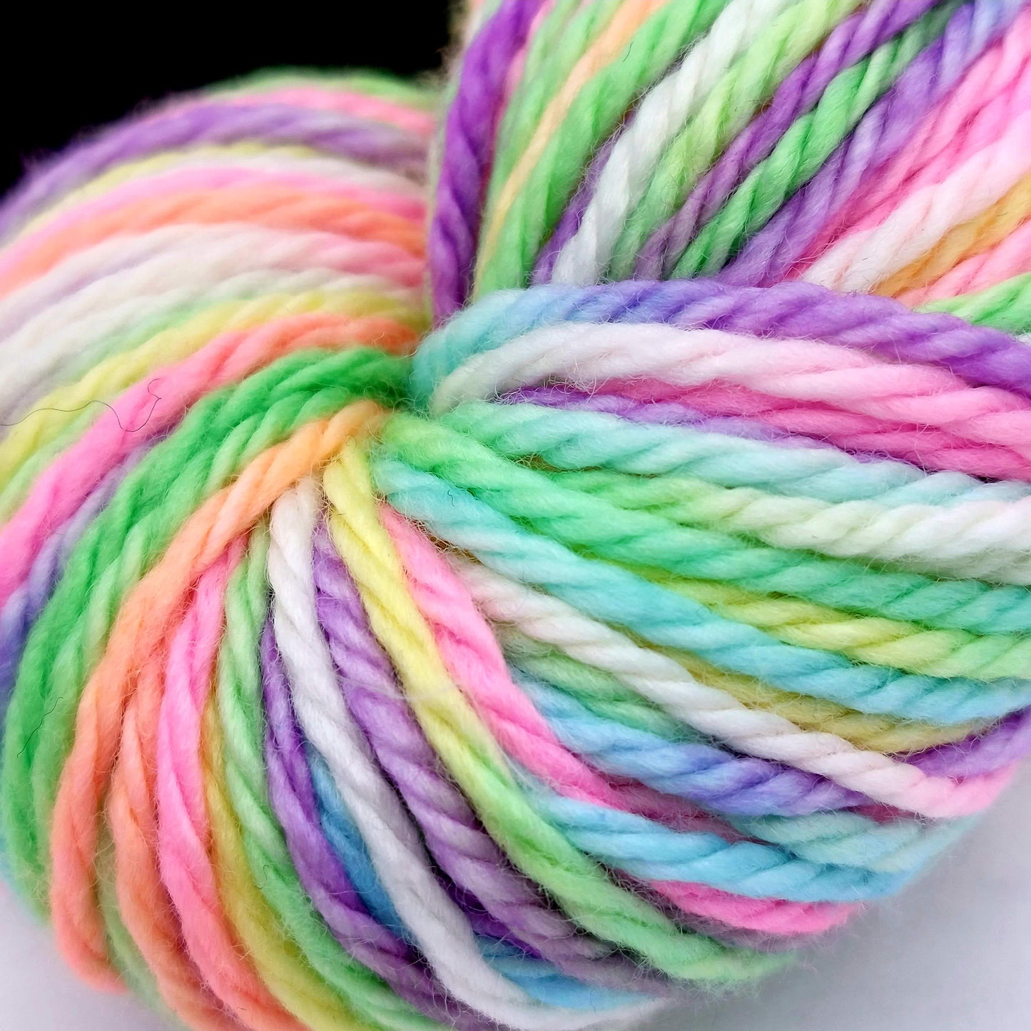Close up of hand dye wool -yarn in white, purple, pink, yellow, pale blue, light green