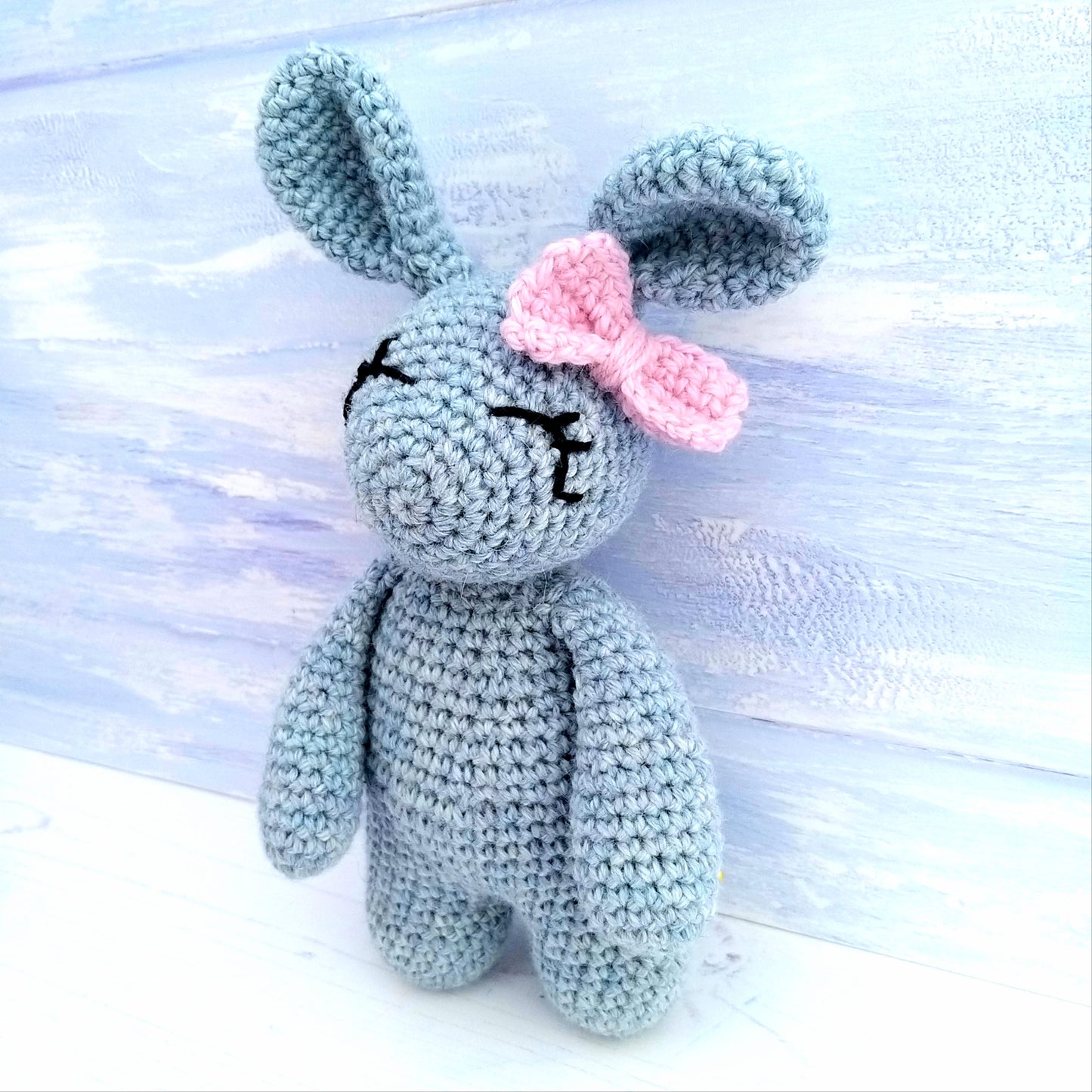 Grey rabbit with pink bow